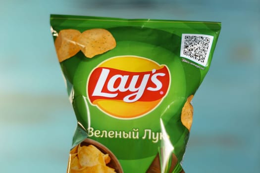 Tyumen, Russia-January 06, 2023: Lays brand potato chips, worldwide famous brand of potato crisps.