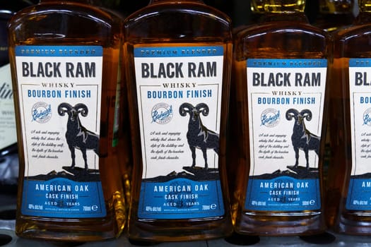Tyumen, Russia-March 17, 2023: Whiskey brand Black Ram at supermarket shelf. Strong alcoholic beverages. Selective focus