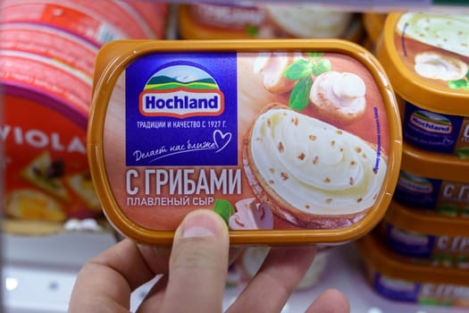 Tyumen, Russia-March 17, 2023: Close up Hochland cheese slices. Produced by Hochland 1927