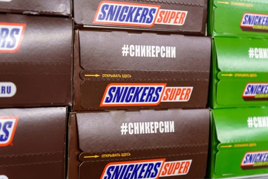 Tyumen, Russia-March 17, 2023: Snickers box is a well known brand of chocolates from the USA. On supermarket shelves