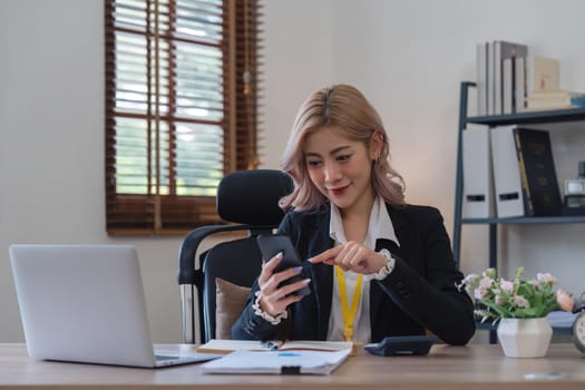business woman with phone for communication typing while smile happy and relax.