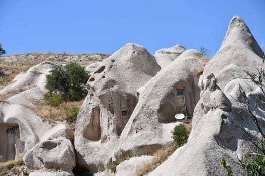 Cave houses in sandstone in Goreme, Cappadocia, Turkey on a sunny day