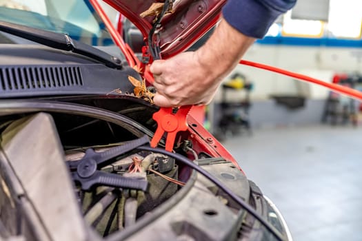 starting the car engine using the starter cable.