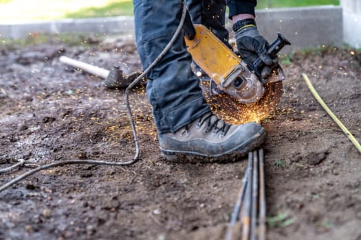 cutting iron fittings with a grinder.