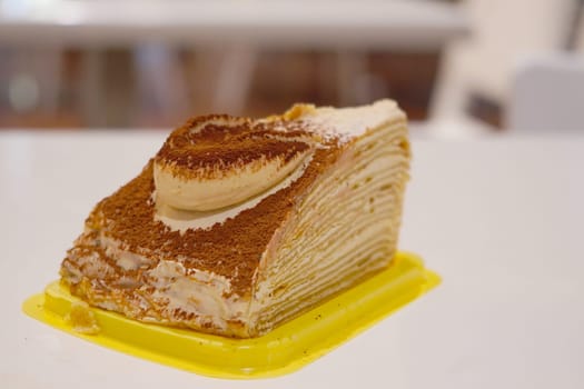 Close up of mile crepe cheese layered cake. Food photography.