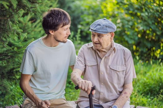 Grandfather and adult grandson spend time together in the park.