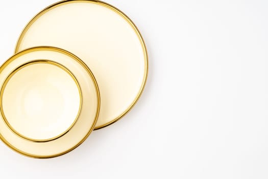 A golden luxury ceramic kitchen utensils on a white background