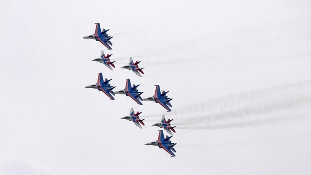 MOSCOW, RUSSIA - MAY 7, 2021: Avia parade in Moscow. group jet fighter aircraft MiG-35 and Su-30 in the sky on parade of Victory in World War II in Moscow, Russia