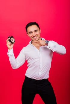 It is your time. Portrait of young man in showing time on a clock watch, ok, thumb up, approve