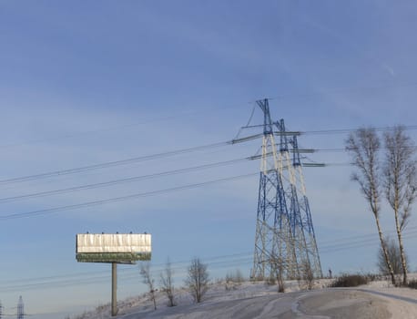 Electricity Pylon standard overhead power line transmission tower on the sky background.