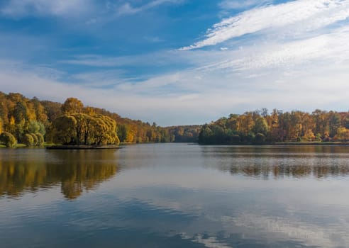 Autumn foliage with water reflection natural landscape.