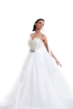 Young beautiful bride posing in fashionable dress, isolated on white