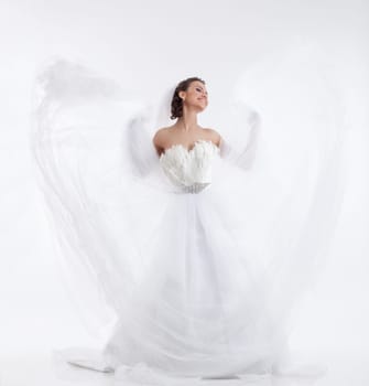 Cheerful beautiful bride isolated on white background