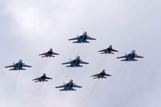 MOSCOW, RUSSIA - MAY 7, 2021: Avia parade in Moscow. group jet fighter aircraft MiG-35 and Su-30 in the sky on parade of Victory in World War II in Moscow, Russia