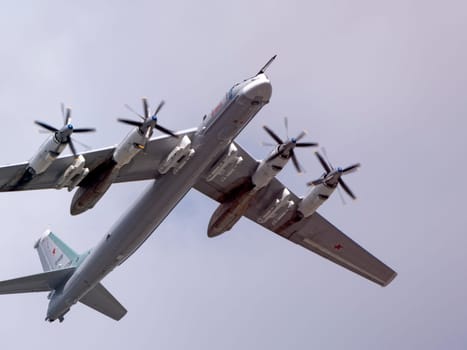MOSCOW, RUSSIA - MAY 7, 2021: Avia parade in Moscow. strategic bomber and missile platform Tu-95 in the sky on parade of Victory in World War II in Moscow, Russia
