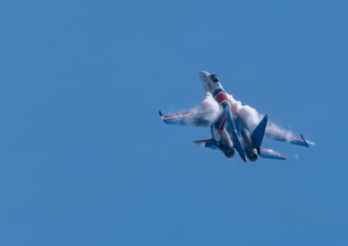 Moscow Russia Zhukovsky Airfield 31 August 2019: The Russian Knights Russkie Vityazi aerobatic team performs a demonstration flight with aerobatics figures of the international aerospace salon MAKS-2019.
