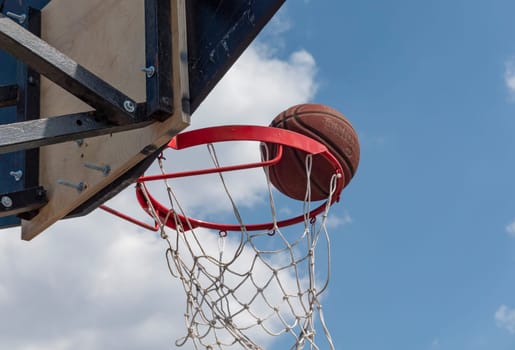 Ring and ball on background of the sky.