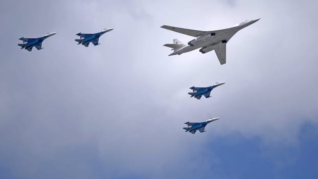 MOSCOW, RUSSIA - MAY 7, 2021: Avia parade in Moscow. su-35 and strategic bomber and missile platform Tu-160 in the sky on parade of Victory in World War II in Moscow, Russia
