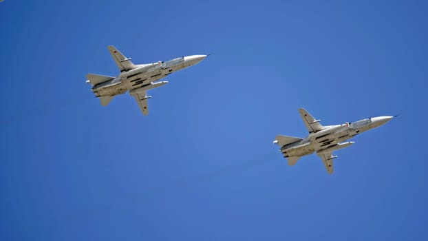 MOSCOW, RUSSIA - MAY 7, 2021: Avia parade in Moscow. jet fighter aircraft Su-24 in the sky on parade of Victory in World War II in Moscow, Russia