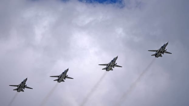 MOSCOW, RUSSIA - MAY 7, 2021: Avia parade in Moscow. jet fighter aircraft Su-24 in the sky on parade of Victory in World War II in Moscow, Russia