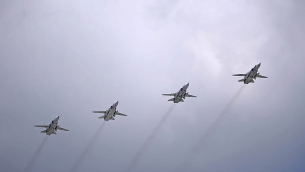 MOSCOW, RUSSIA - MAY 7, 2021: Avia parade in Moscow. jet fighter aircraft Su-24 in the sky on parade of Victory in World War II in Moscow, Russia