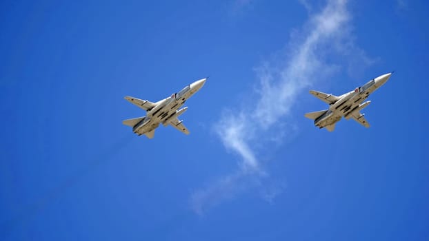MOSCOW, RUSSIA - MAY 7, 2021: Avia parade in Moscow. jet fighter aircraft Su-24 in the sky on parade of Victory in World War II in Moscow, Russia