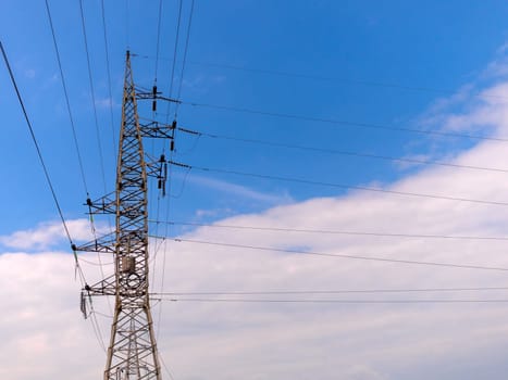 cloudy morning sky and a high-voltage line.