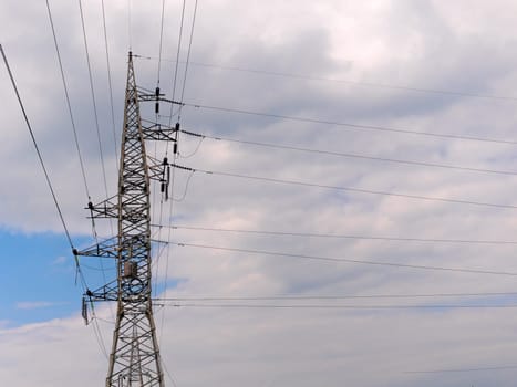 cloudy morning sky and a high-voltage line.