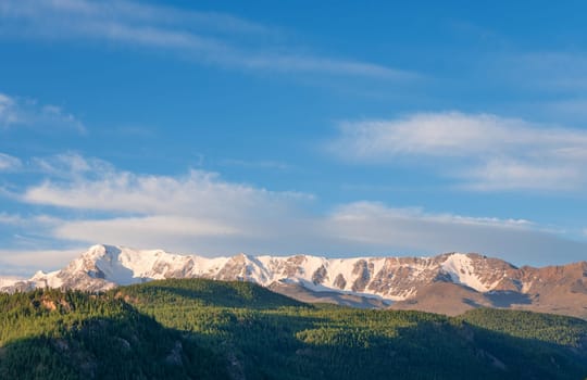 Beautiful winter landscape with snow covered mountain peaks.
