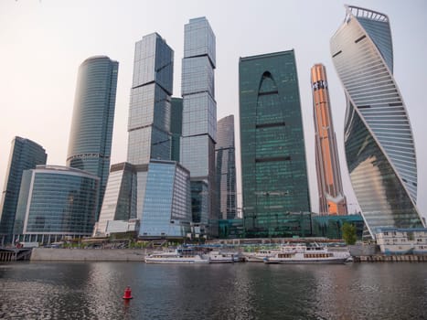 Modern buildings of glass and steel skyscrapers against the sky.