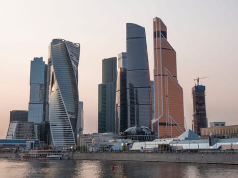 Modern buildings of glass and steel skyscrapers against the sky.