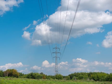 cloudy morning sky and a high-voltage line.