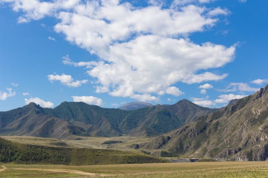 Beautiful mountain landscape with clouds in the sky.