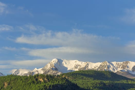 Beautiful winter landscape with snow covered mountain peaks.