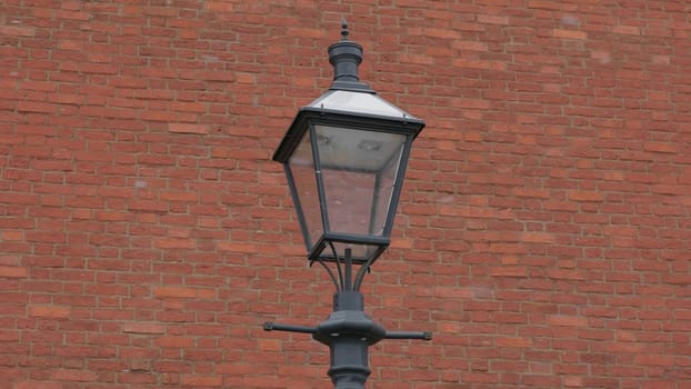 lantern on a background of ancient brick walls of the Kremlin.