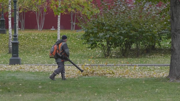 Working blows autumn leaves vacuum blower.