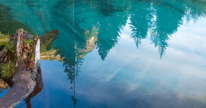 Amazing blue geyser lake in the mountains of Altai, Russia.