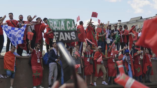 MOSCOW - JUNE 20, 2018: Soccer World Cup Fanatics of Morocco with flags with their typical costumes in the streets June 20, 2018 in Moscow, Russia.