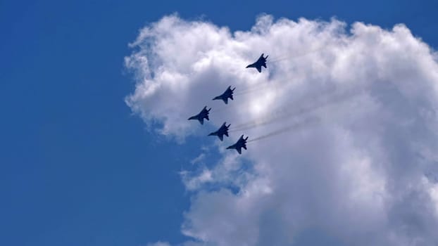 Moscow Russia Zhukovsky Airfield 25 July 2021: Aerobatic teams Russian Knights on planes Su-35 of the international aerospace salon MAKS-2021.
