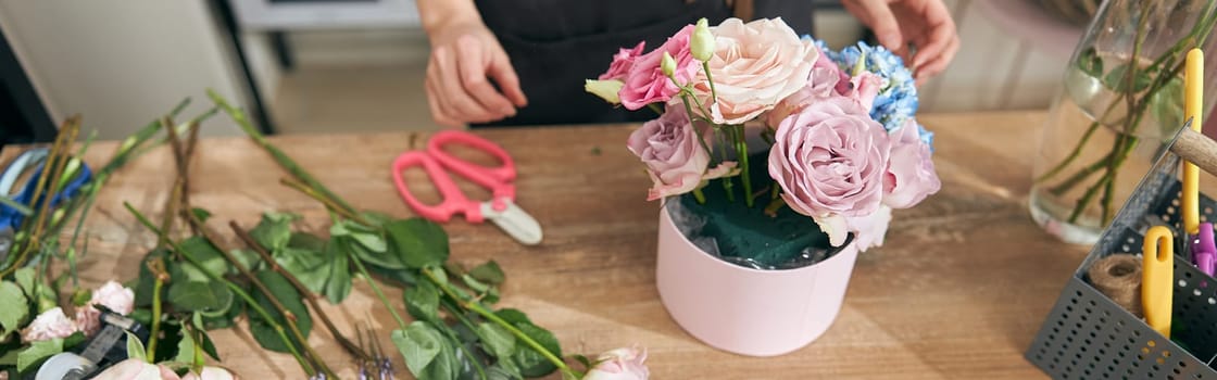 happy professional woman is working in flower shop