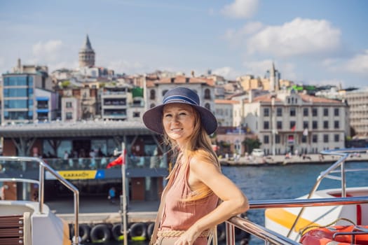 Happy woman enjoying the sea from ferry boat crossing Bosphorus in Istanbul. Summer trip to Istanbul.