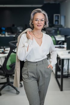 Portrait of an attractive mature caucasian woman in the office