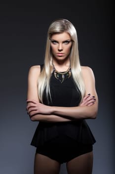 Portrait of young strict blonde looking at camera, close-up