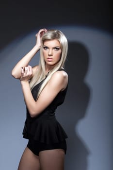Image of sensual young girl on gray background, close-up