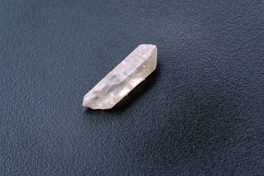 Natural mineral from geological collection raw clear quartz rock crystal stone, black background