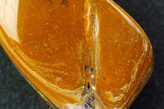 Natural mineral stone tiger eye gemstone. Close up, macro