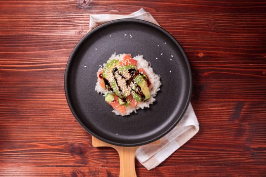Sushi Waffles food trend, made with a crispy rice waffle and topped off with salmon, cucumber, and avocado. Flat lay