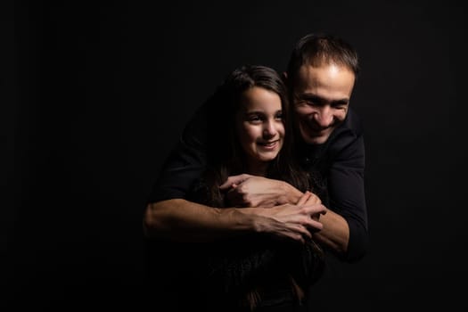 Loving daddy look at little adorable daughter feeling love isolated on studio background profile faces side view, deep devotion warm relationships, love care, closest person, fathers day concept.