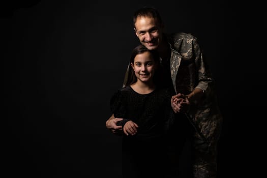 military man and daughter on a black background.