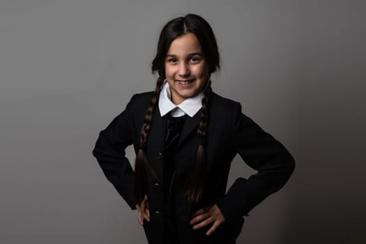 Halloween. A girl in a suit. Holiday. Hallowmas. Wednesday Addams. The Addams Family. Reincarnation. Cosplay. Idea for Halloween. Portrait of a girl